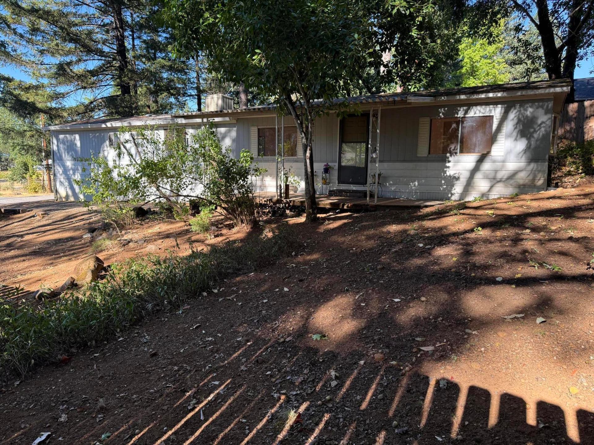 frull view of home-front yard. Photo 3 of 23, 105 Raymond Street, Cave Junction, OR 97523