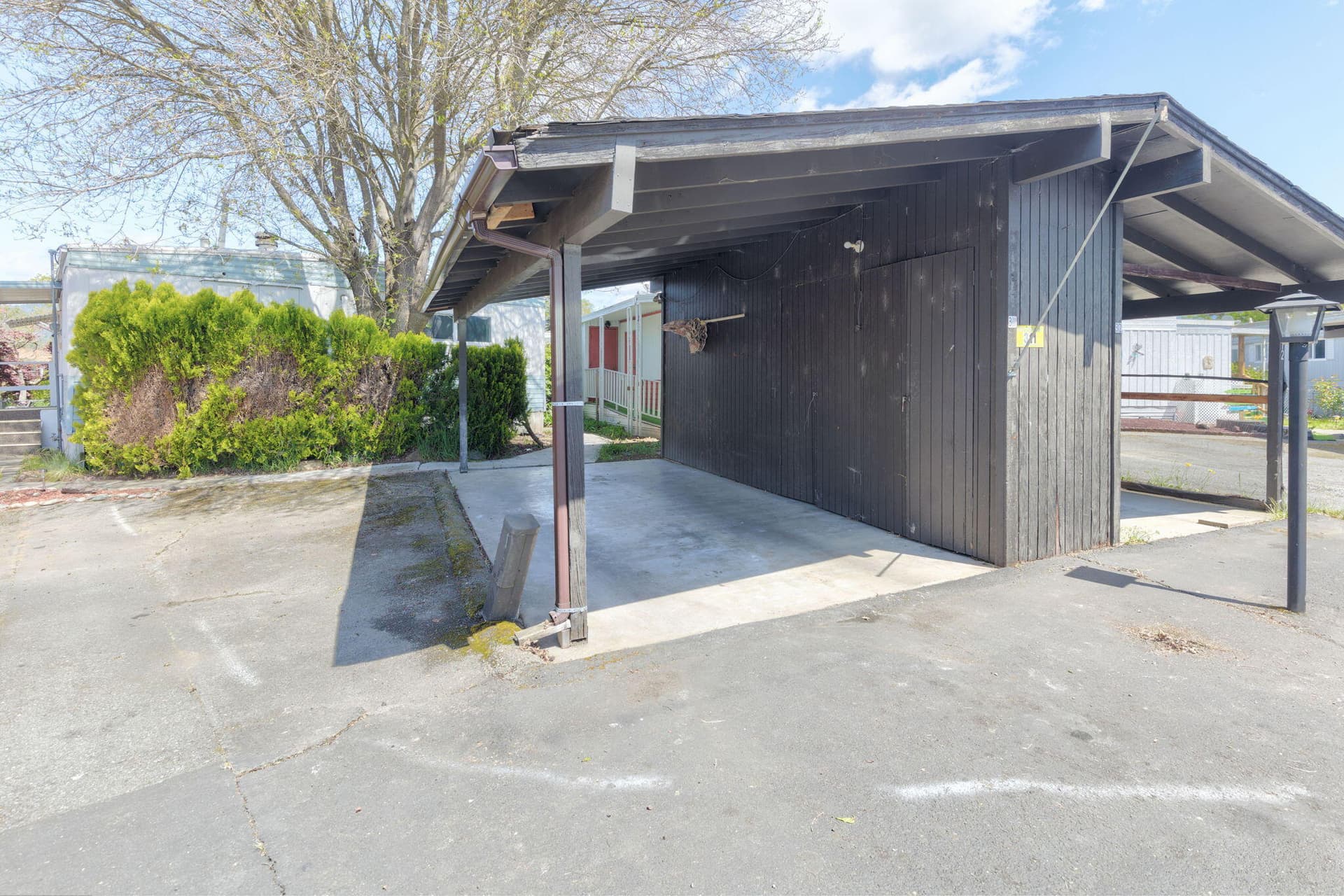 carport with storage. Photo 2 of 30, 311 Bandy Way, Grants Pass, OR 97526