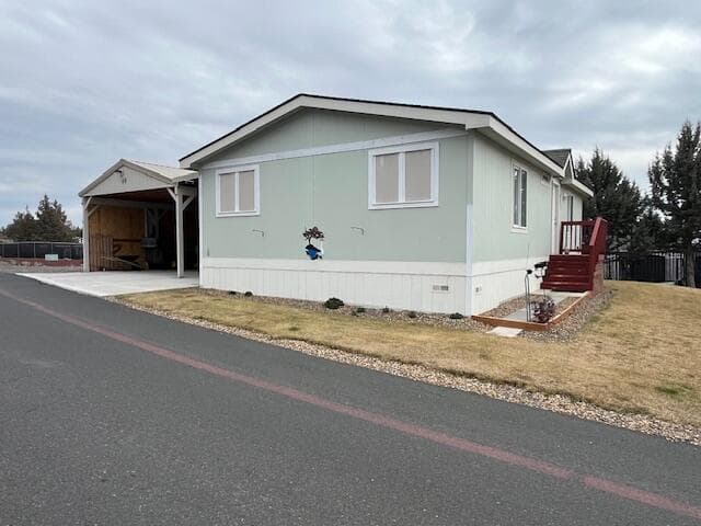 Front of home #49. Photo 1 of 39, 6100 S Highway 97 Unit UNIT 49, Redmond, OR 97756