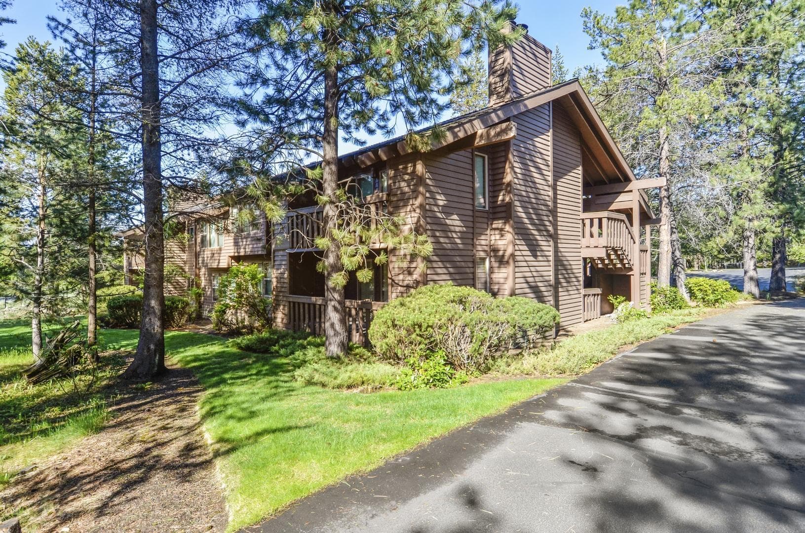 exterior back view. Photo 2 of 23, 57301 Beaver Ridge Loop Unit 10, Sunriver, OR 97707