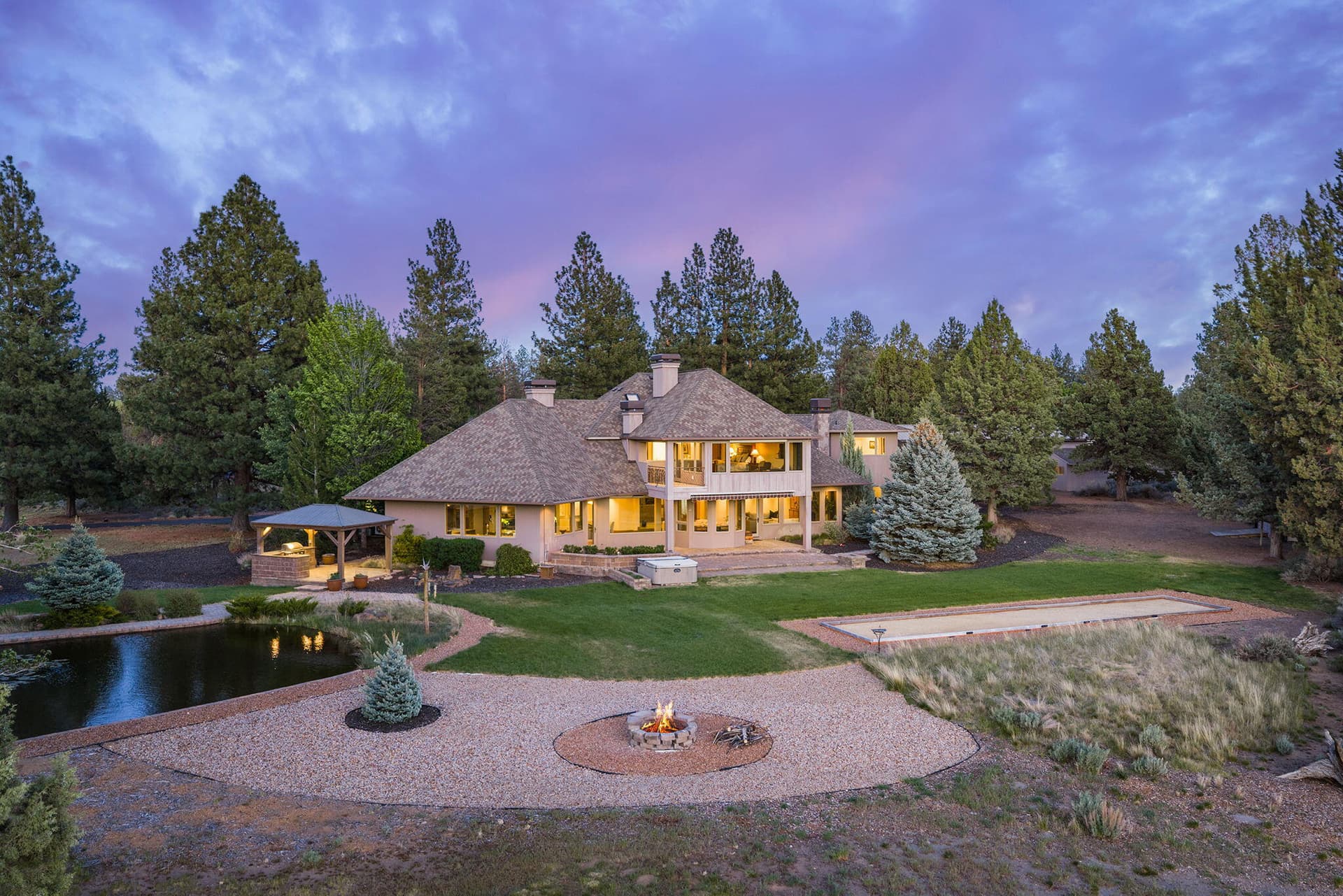1. House and pond twilight. Photo 1 of 60, 21725 Rickard Road, Bend, OR 97702