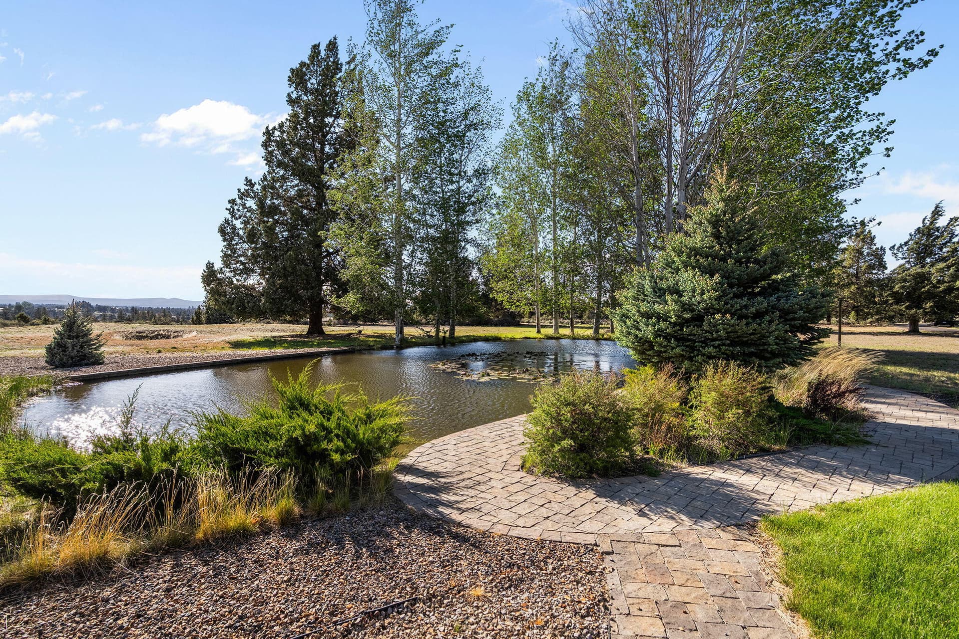 5. Back yard and pond. Photo 5 of 60, 21725 Rickard Road, Bend, OR 97702