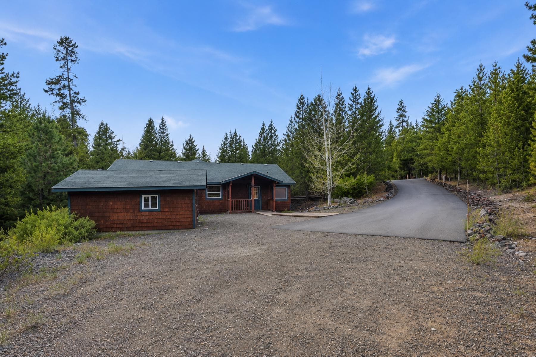 Below driveway looking up. Photo 4 of 49, 19140 Springfield Court, Crescent Lake, OR 97733