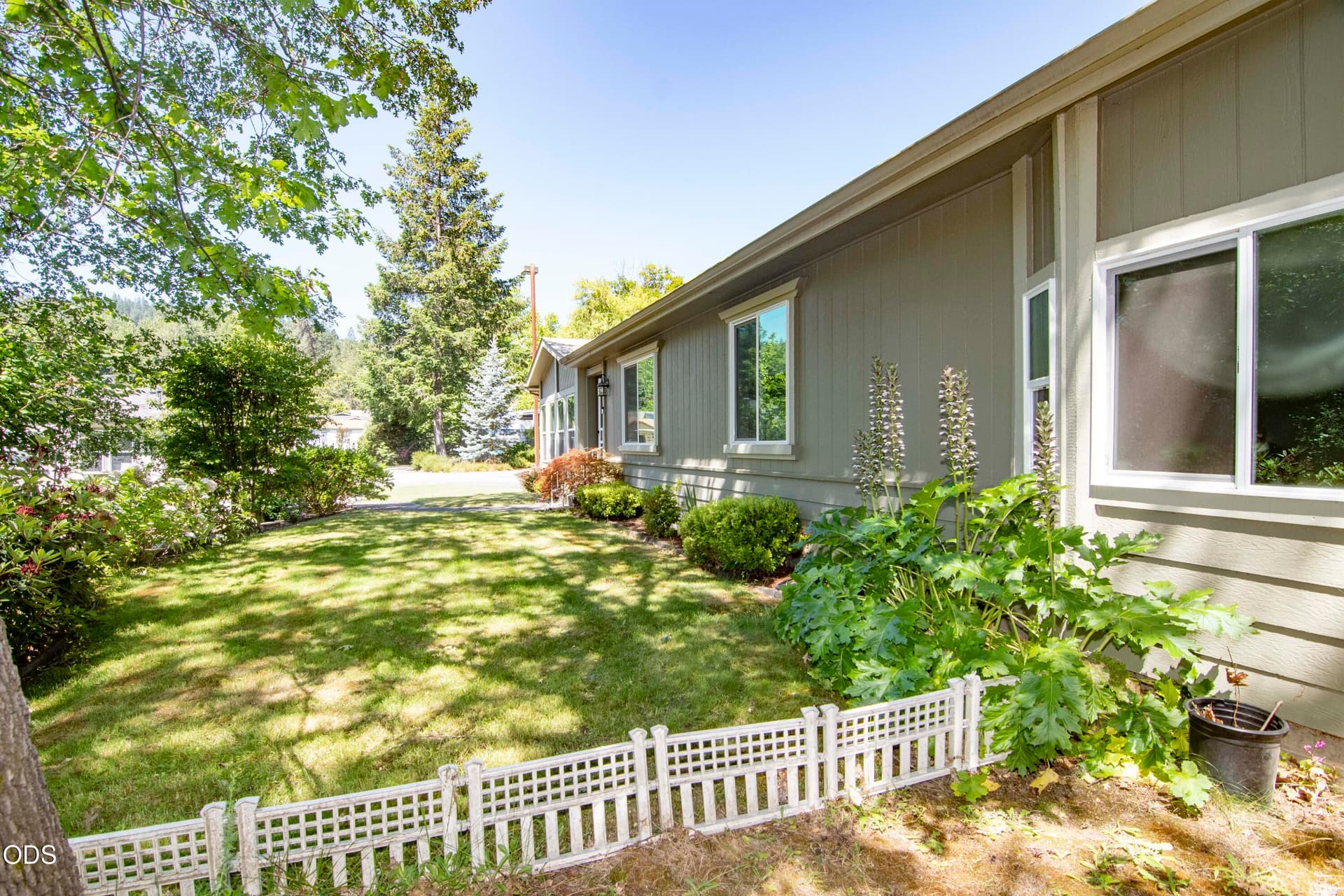 Side Yard & Front Door Faces the Creek. Photo 3 of 35, 125 NW Wrightwood Circle, Grants Pass, OR 97526