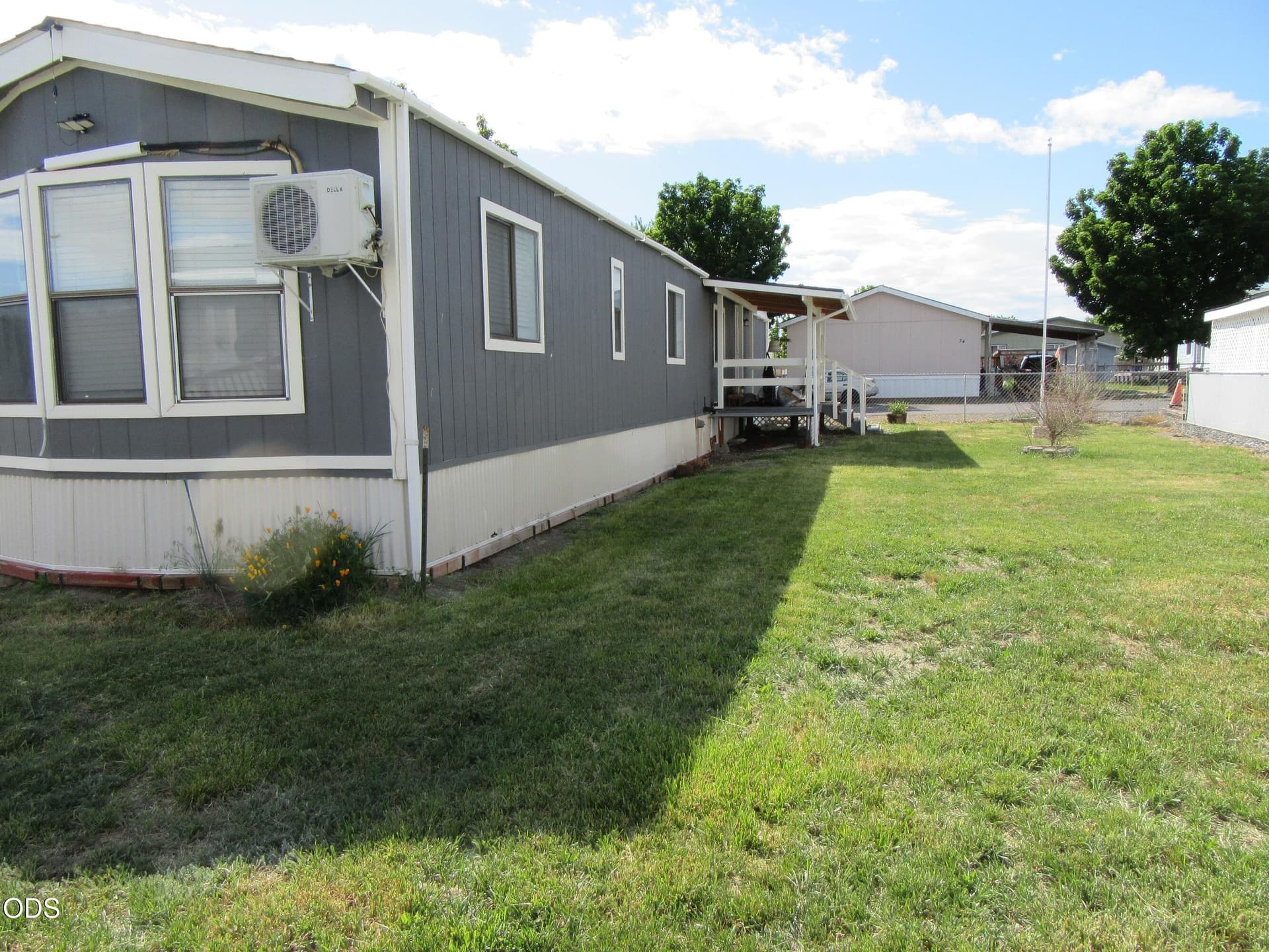 View of main Lawn from back of fenced ya. Photo 5 of 23, 4751 Bellm Drive Unit SPC 33, Klamath Falls, OR 97603