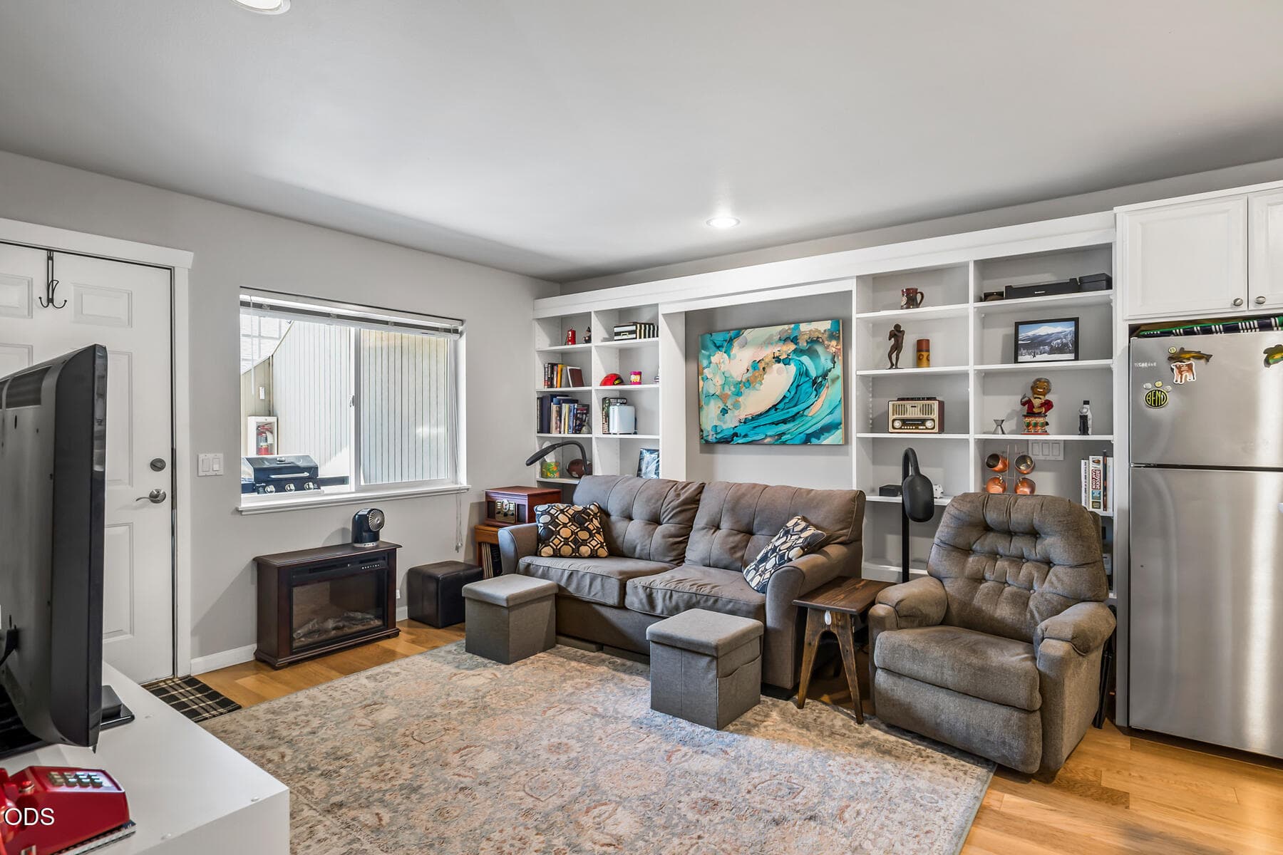 4. Living Room with Built-In Shelves. Photo 4 of 30, 1527 NW Juniper Street Unit APT 2, Bend, OR 97703