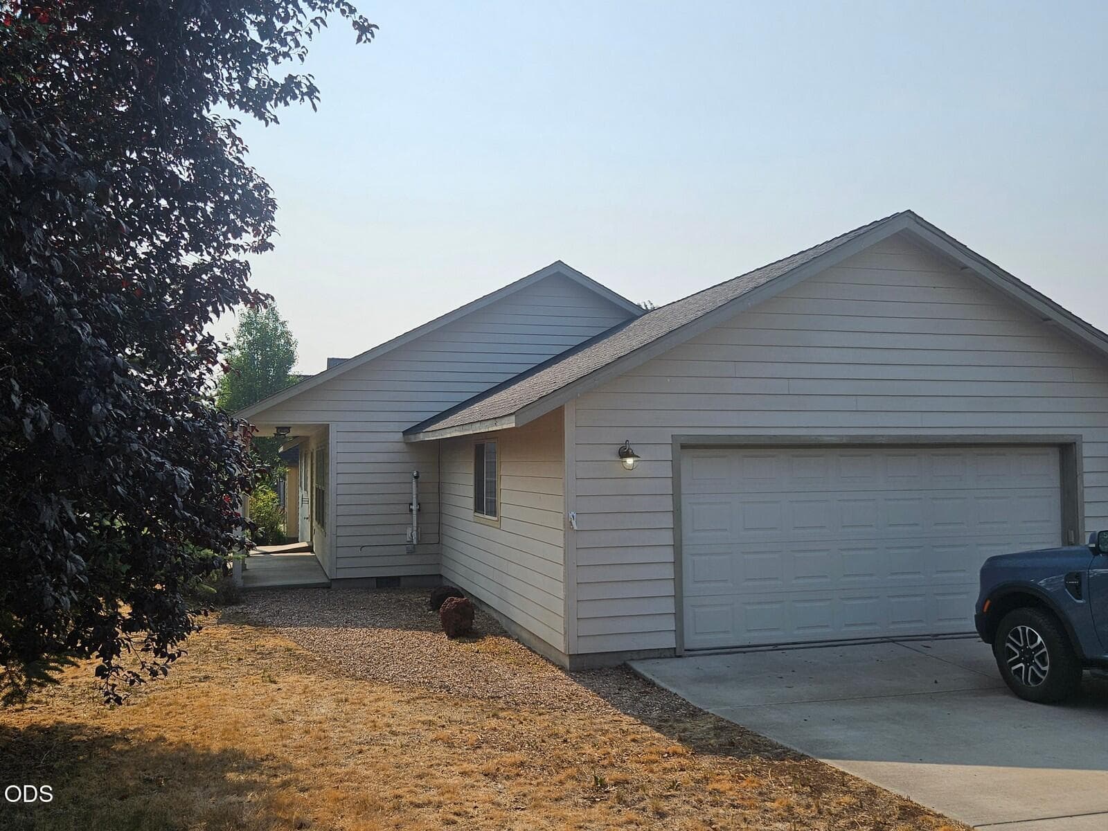 Side load 2-car garage. Photo 2 of 22, 825 NW Poplar Place, Redmond, OR 97756