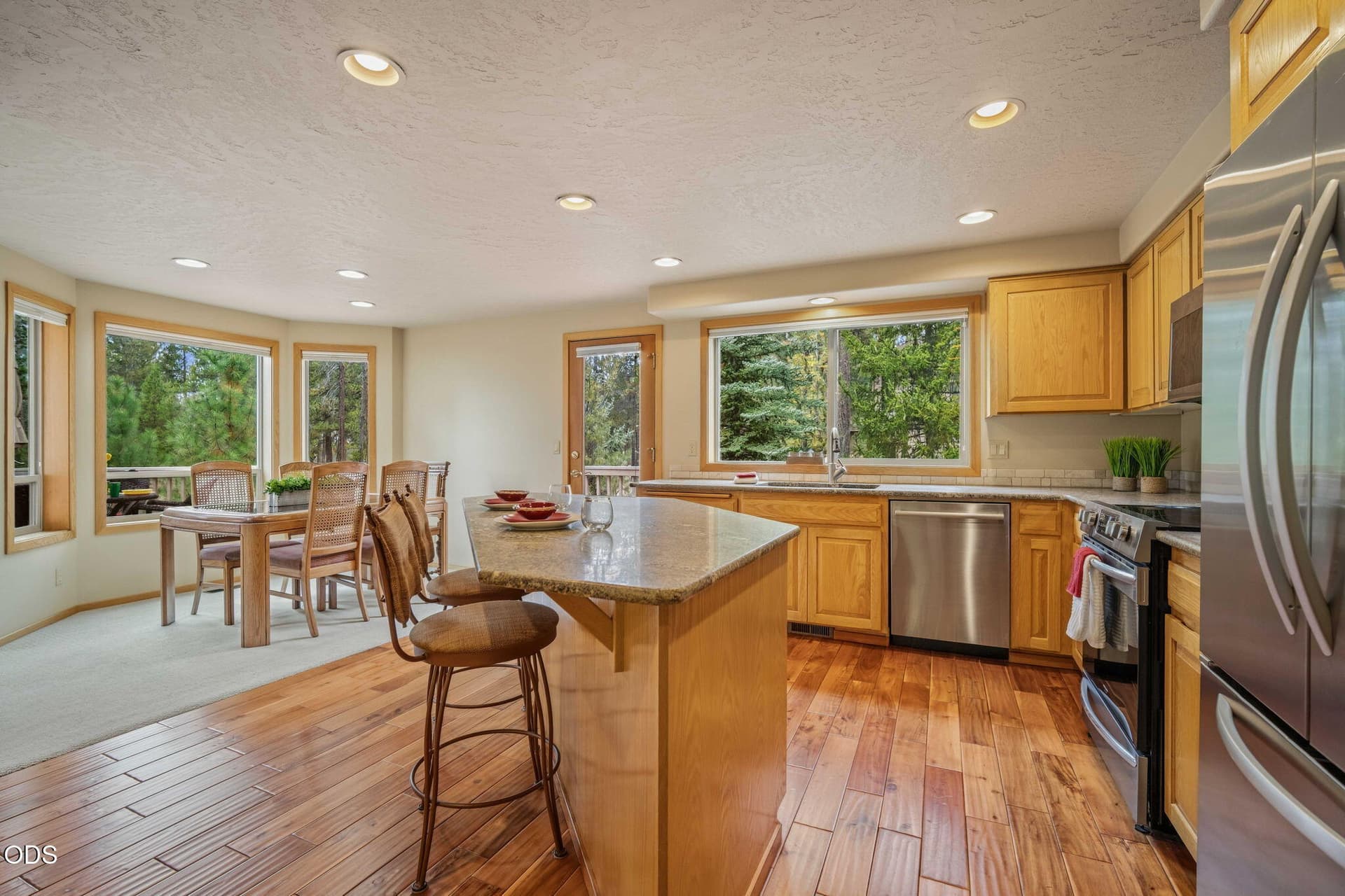 kitchen with breakfast bar. Photo 4 of 32, 57983 Cypress Lane Unit 1, Sunriver, OR 97707