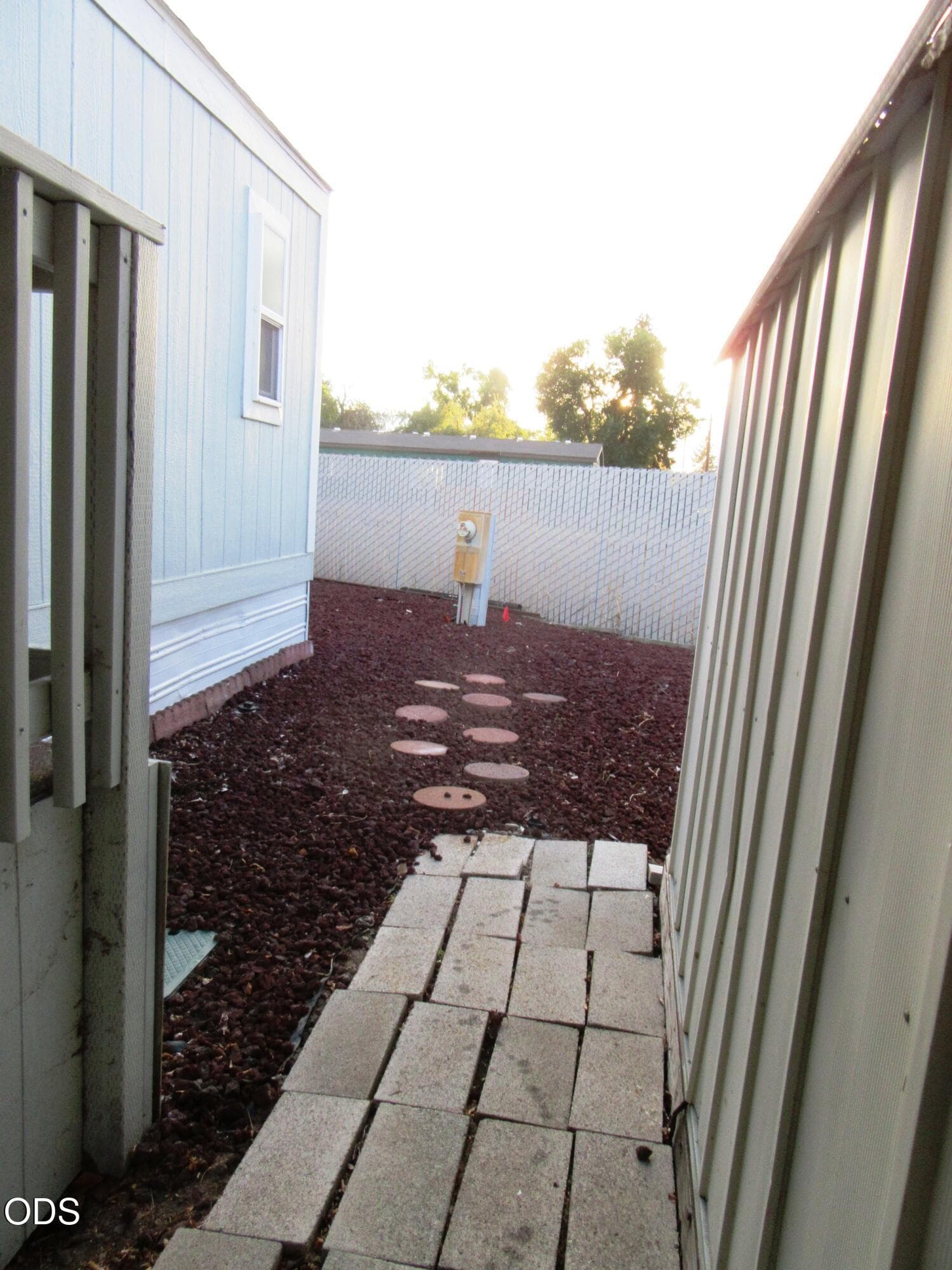 Carport Side looking toward back of yard. Photo 4 of 6, 3500 Summers Lane Unit UNIT 15, Klamath Falls, OR 97603
