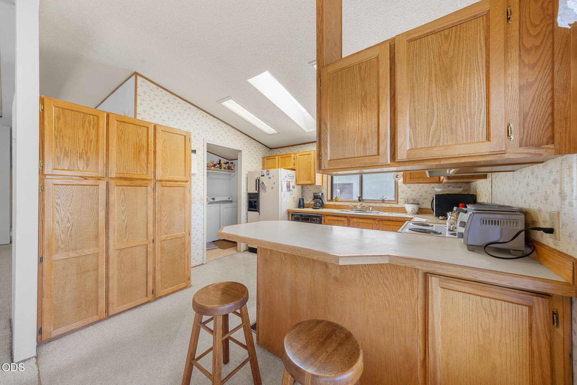 Kitchen/Laundry. Photo 5 of 31, 63704 Ranch Village Drive Unit # 97, Bend, OR 97701