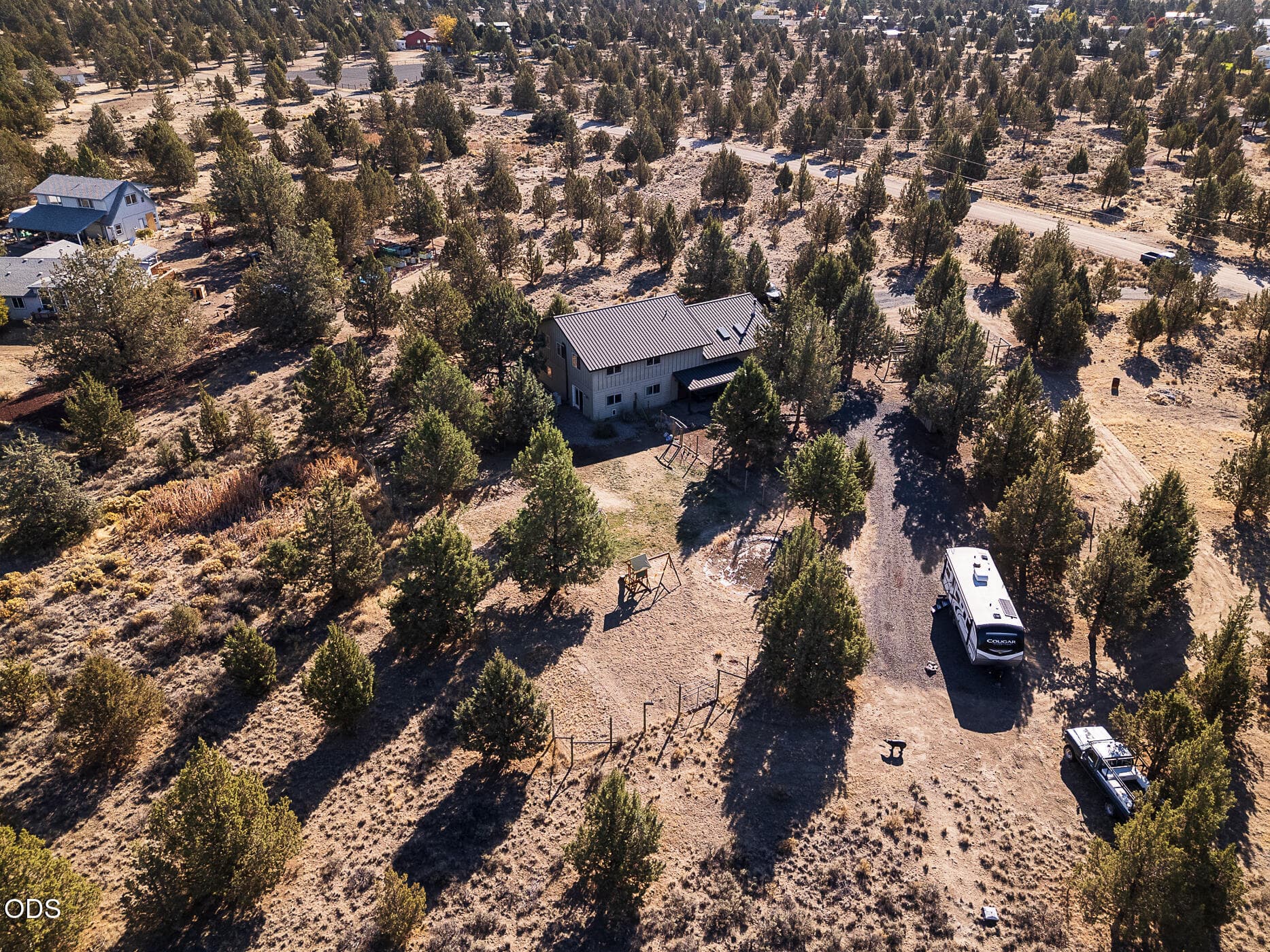 1 drone side with porch far. Photo 1 of 54, 10001 SW Geneva View Road, Terrebonne, OR 97760