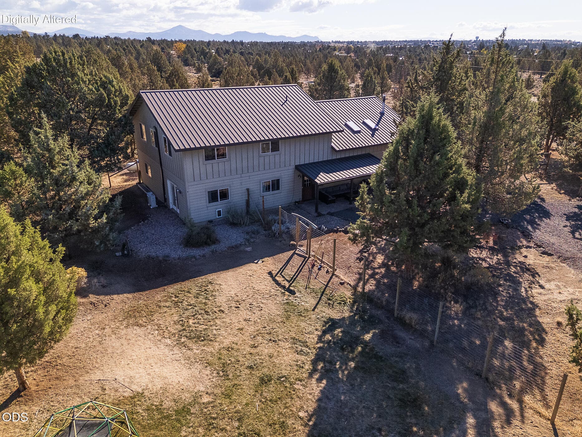 2 side of house with porch drone. Photo 3 of 54, 10001 SW Geneva View Road, Terrebonne, OR 97760